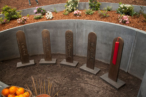 Bronze Headstones with Chinese Characters at the Evergreen Chinese Memorial in Santa Cruz